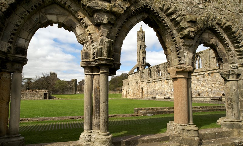 A picture of the ruins of St Andrews Cathedral taken from one of its arches.